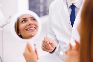 woman smiling in mirror