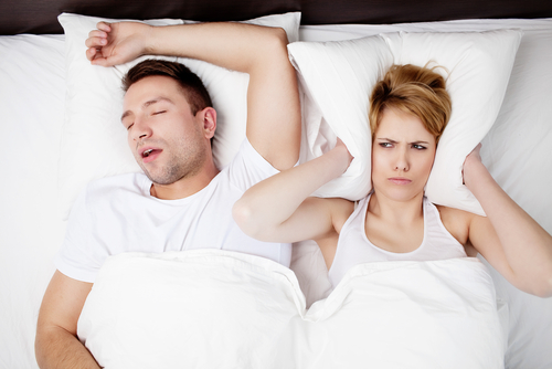 Snoring,Man,And,Young,Woman.,Couple,Sleeping,In,Bed.