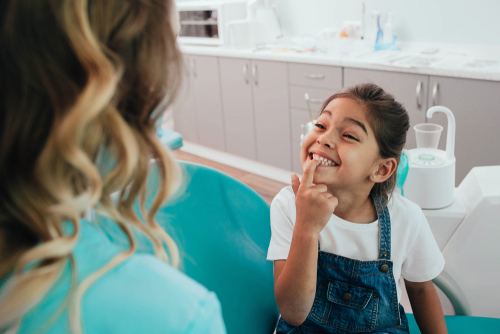 young girl at the dentist office