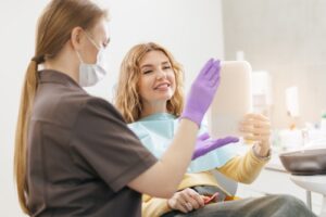 Young,,Female,Enjoying,Result,After,Dental,Treatment,Of,Broken tooth