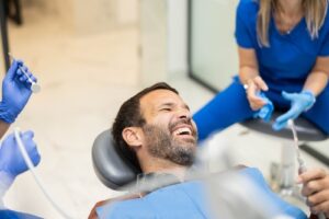 A,Male,Patient,Shares,A,Light-hearted,Moment,With,Dental,Professionals